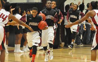 The varsity boys take the court in the home opener against James Clemens. 