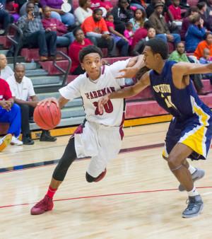 Freshman Jamal Johnson dribbles past a Buckhorn defender to become the team's leading scorer.