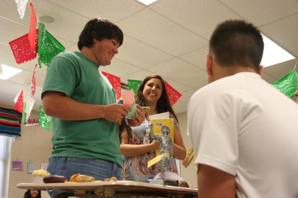 Students interact with each other using only Spanish