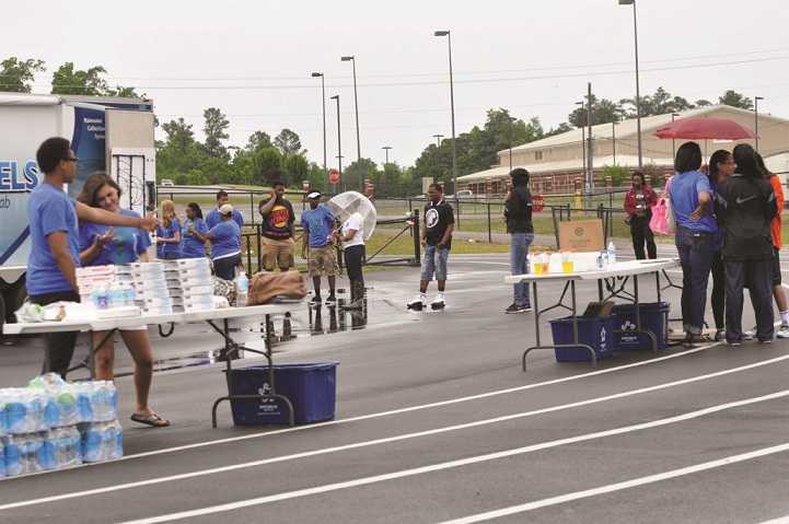 Environment Club members hand out food and water at the walkathon.