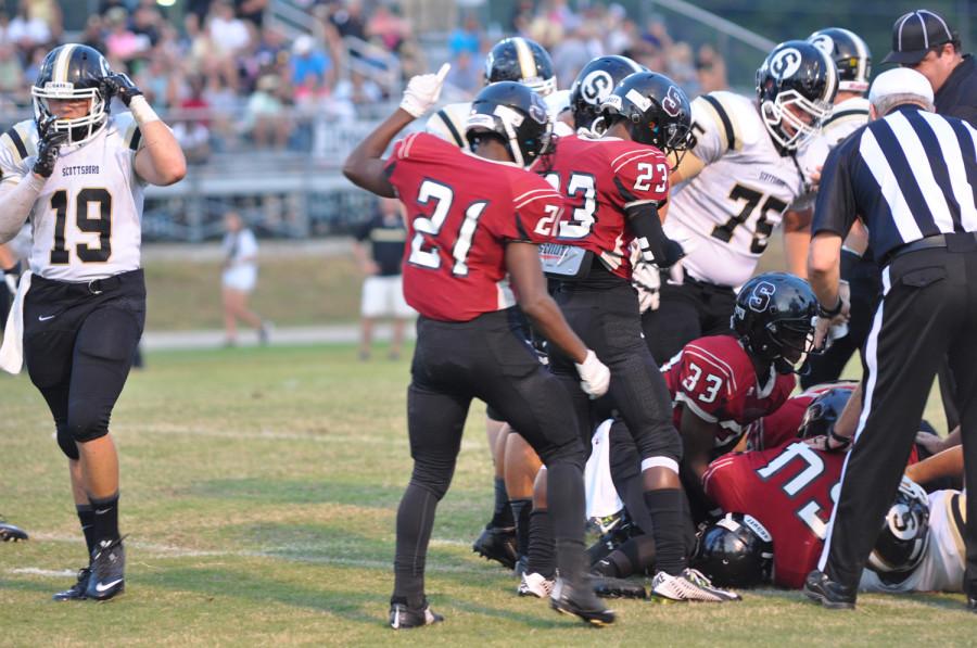 The team signals that they have the ball after a Scottsboro fumble. 