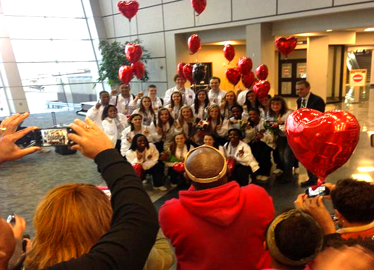 Michael Campbell came over the intercom before the day was over to encourage students to meet the cheer team upon their return at the airport.

Credit to @kdjeiss s twitter for the original photo.