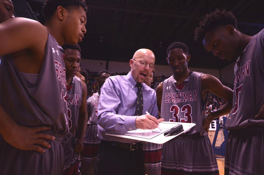 Jamie Coggins coaching the team to keep their lead in the second half.