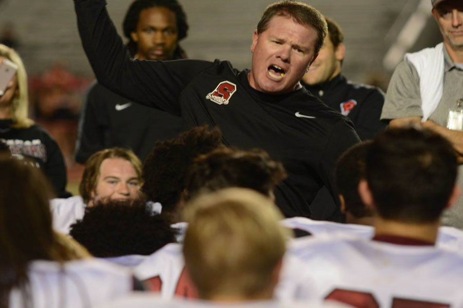 Coach Cagle praises his team for their victory after the Thursday night game. 