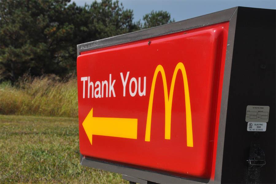 McDonalds thanks their customers as they leave one of their restaurants. 