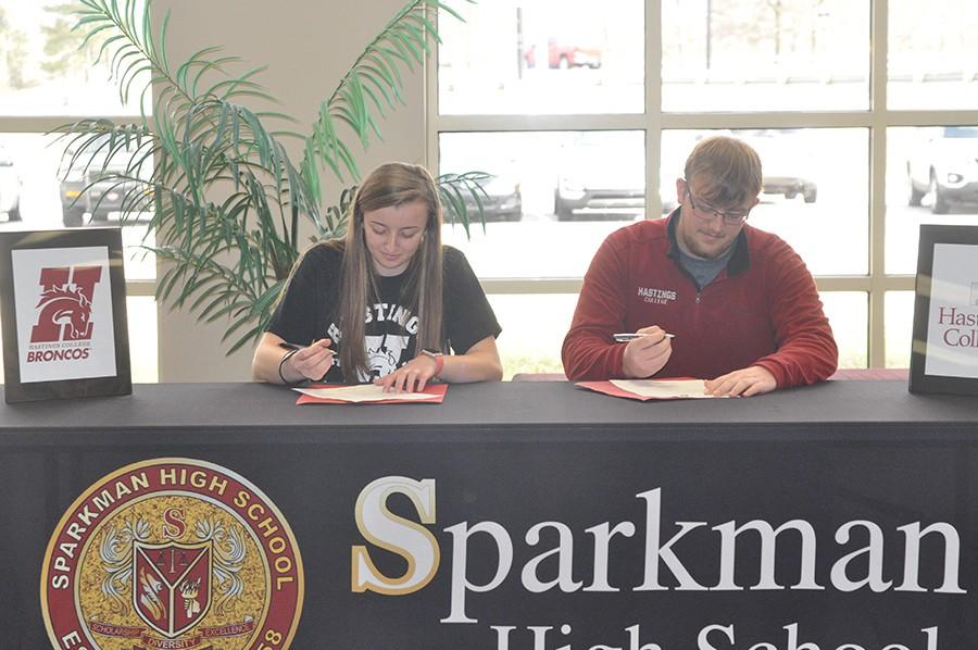 By signing their official bowling scholarships, Beth and Doug Fowler become the first Sparkman students to bowl in college. 