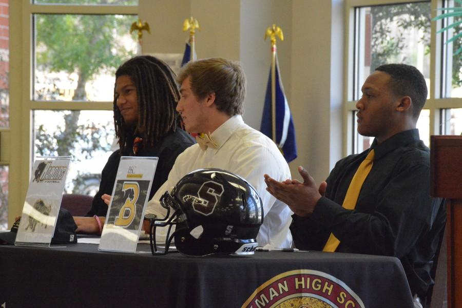 Seniors+Mason+Edwards%2C+Jesse+Beck+and+Kendrian+Koger+sign+their+football+scholarships+on+National+Signing+Day.+