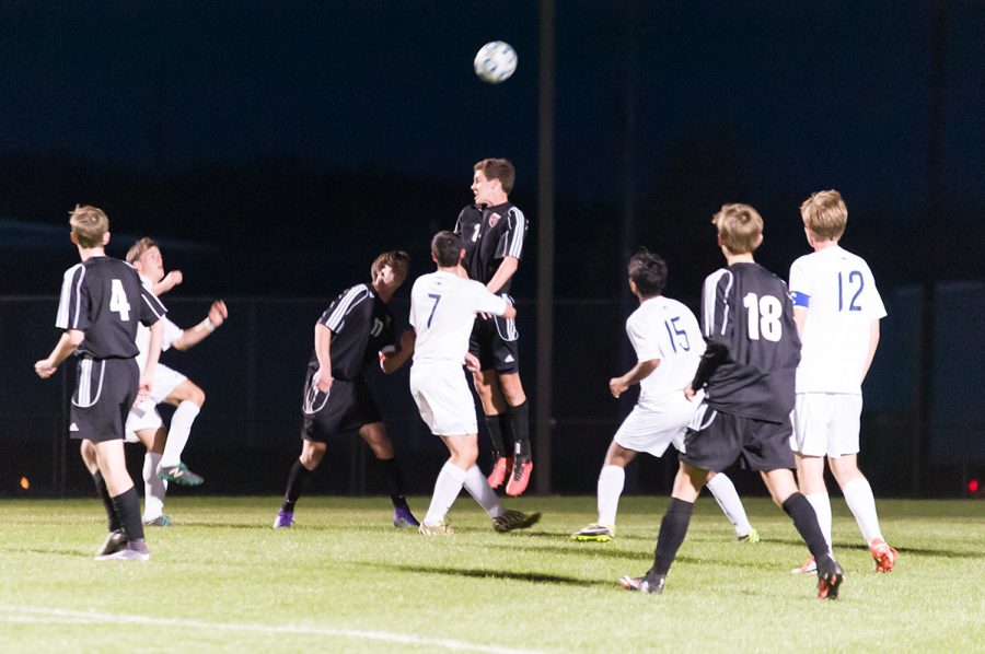 Junior Tanner Bell makes a move on the ball with his head to keep the Jets from scoring. 