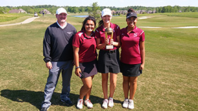 The girls golf team show off their trophy after the meet that qualified them for sub-state. 