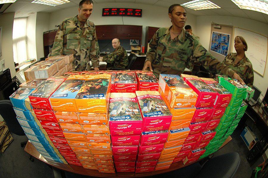 070613-N-0021M-003
SEOUL, Republic of Korea (June 13, 2007) - Yeoman 2nd Class Krystal Trotter reaches for a box of Thin Mints as Chief GunnerÕs Mate Keith Anderson and Aviation Boatswains Mate (Fuel) Altraneise Phillips look on. The 2,798 cases (33,576 boxes) of Girl Scout Cookies arrived at Camp Carroll as pat of the annual Operation Thin Mint. The cookies were then shipped via truck to military personnel on the Korean Peninsula. U.S. Navy photo by Mass Communication Specialist 1st Class Todd Macdonald (RELEASED)
