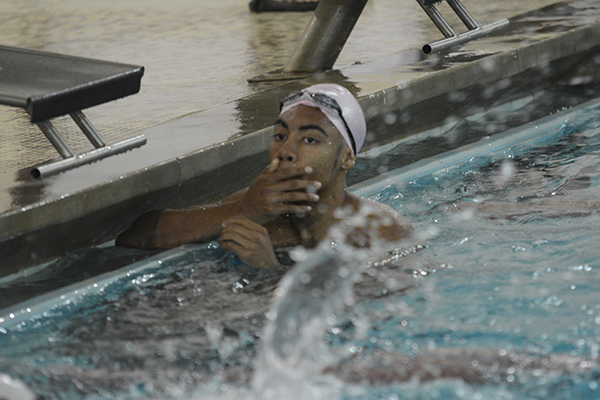 Seniors Jonathan Bolden takes a break from a competition swim. 
