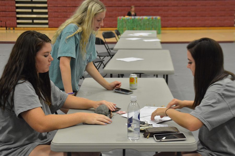 Students complete the parking application at Senator Day. Seniors were given a space while juniors were entered into a lottery to  get a parking pass for the year. 