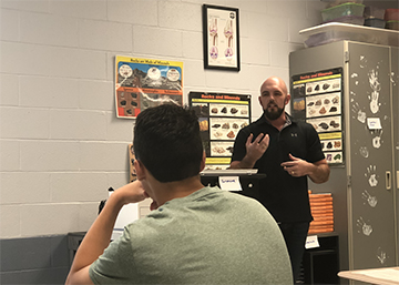 New science teacher Randy Potter teaches his first period class. Potter moved to Huntsville from Texas with his wife. 