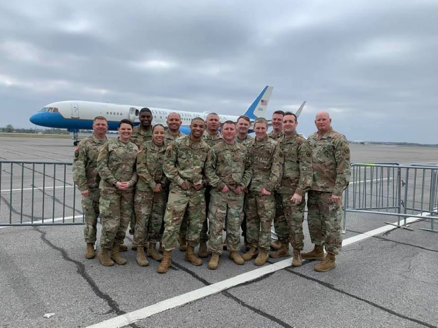 Recruiter Daniel Caldwell (fourth from the left) poses with his unit in front of Air Force One.