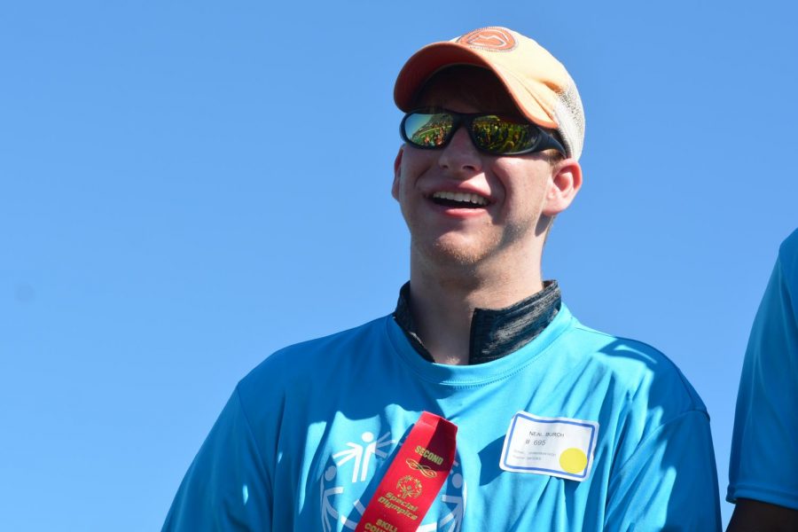 Neal Burch stands proud after receiving his ribbon for the javelin throw. 