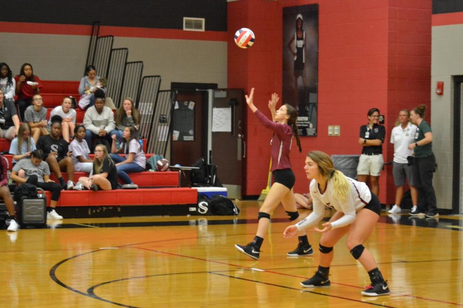 Serving the ball, junior Jessica Buford gets the match started. The team won the area title with a win over Huntsville. 