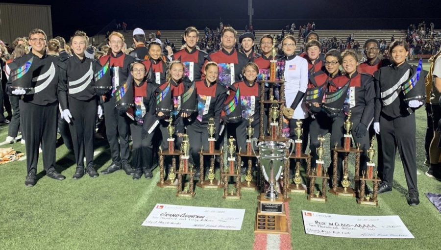 The+band+poses+with+their+array+of+trophies+after+the+Tennessee+Valley+Marching+Band+Competition.+The+band+took+home+the+Grand+Champion+trophy.+