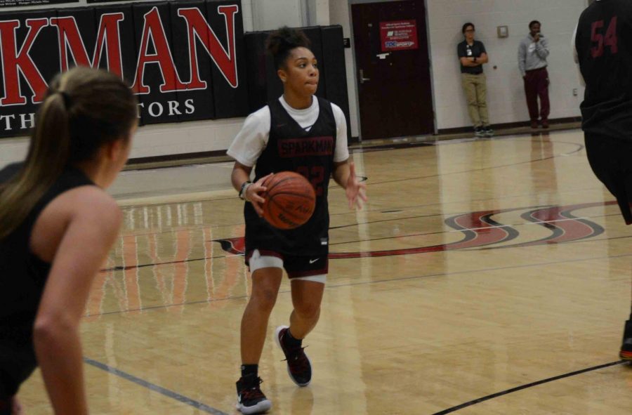 Dribbling up the court, senior Ajana Toney look to pass the ball. The team was introduced to the community on Nov. 5 at the annual Meet the Senators event. 