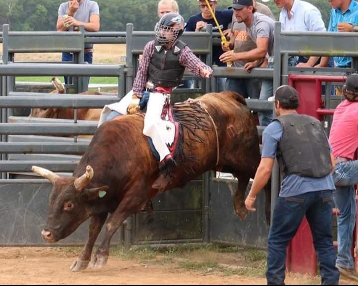 As the chute opens, senior James Pitts holds on to the bull he has drawn. Pitt competes all over the state of Alabama with the Alabama High School Rodeo Association. 