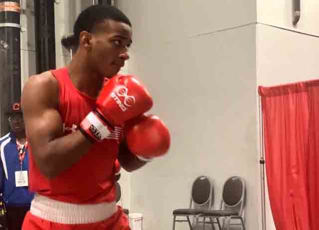 Working on his stance, junior Obed Bartee practices in the ring. 