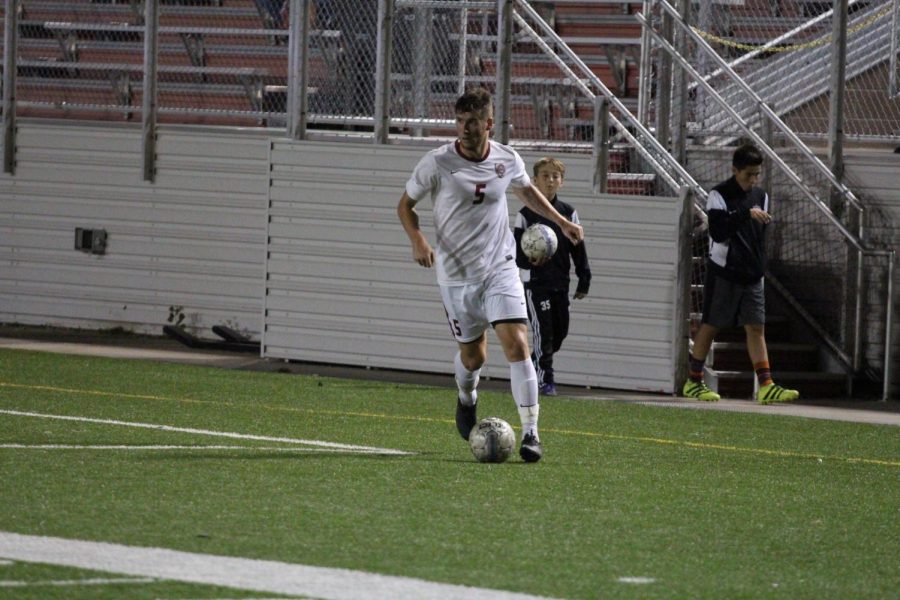 British born, Joshua Horne, plays in a game while in college. Horne will lead the boys soccer program when the practice begins in January. 