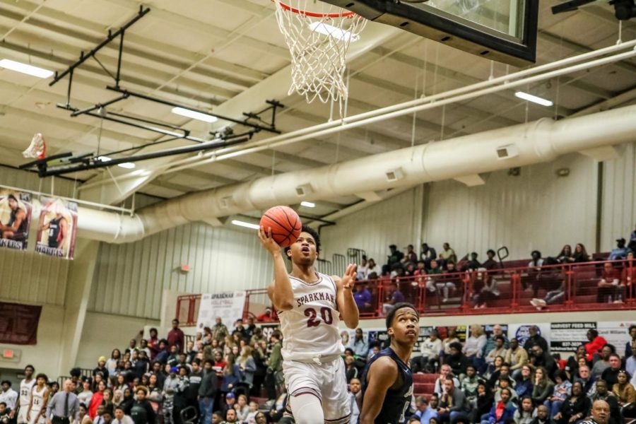 Sophomore Tyrese Elliott goes up for a basket. Elliott hit a 3-pointer at the end of the Gadsden City game to secure the victory. 