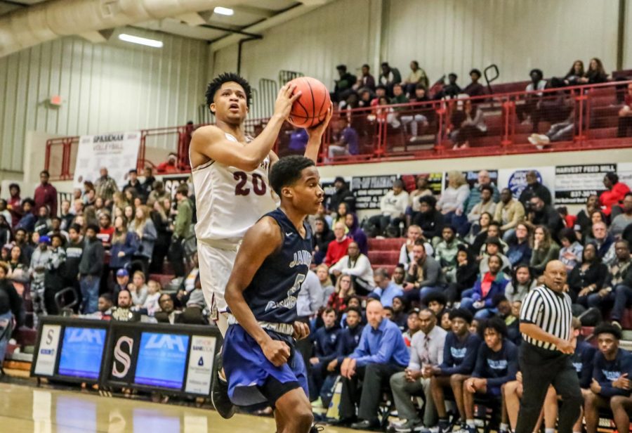 Sophomore Tyrese Elliott goes up for a lay-up against James Clemens. 