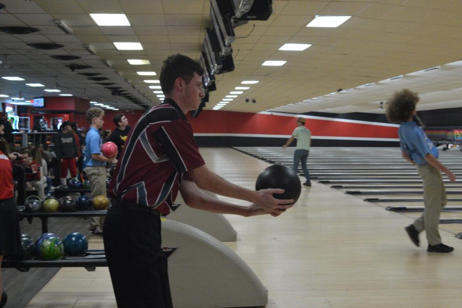Senior Brooks Raby prepares to toss the ball down the lane. Raby played for the first time this season. 