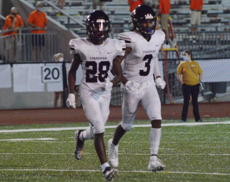 Matthew Rozier and Cam Foley return to the field after a kick off. 