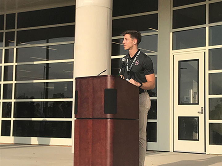 Addressing the audience at the fine arts ribbon cutting ceremony, Cody Carlton says he is happy to be on board at SHS. 