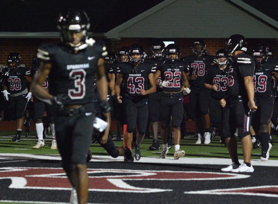 The football team takes to the field for a home game with Austin.