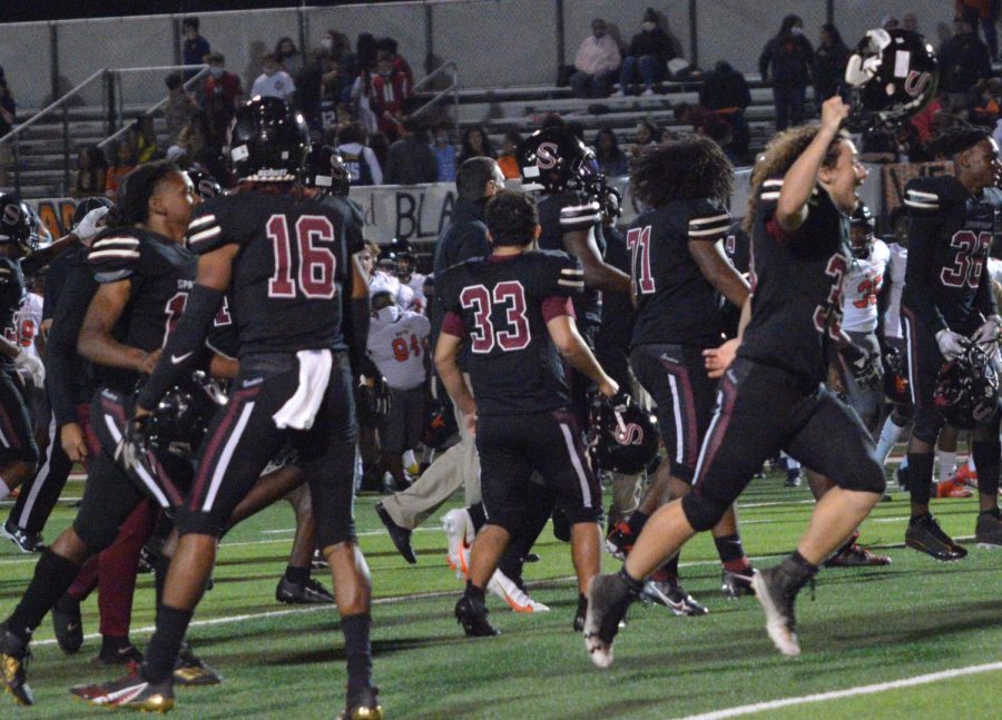 The team celebrates after a big win. 