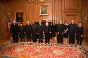 President Trump poses with Supreme Court Justices. 