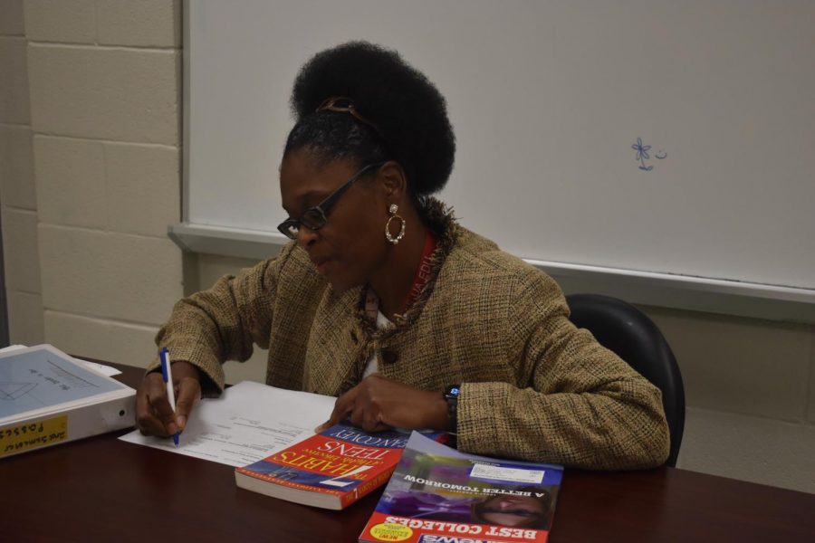 College and Career Counselor Dedra Muhammad works on recommendation letters for students. 