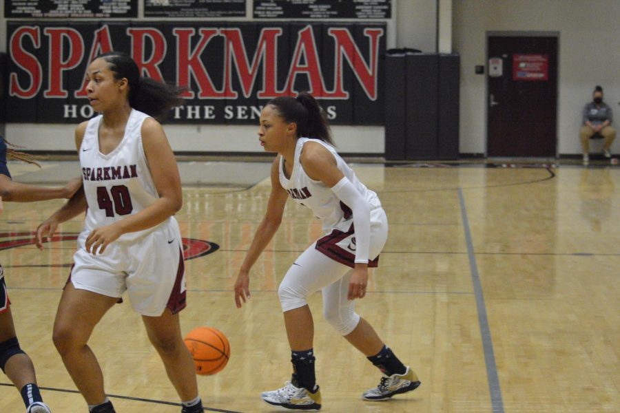 Sophomore Kennedy Langham dribbles the ball up the court to make a play against the Bob Jones defense. 