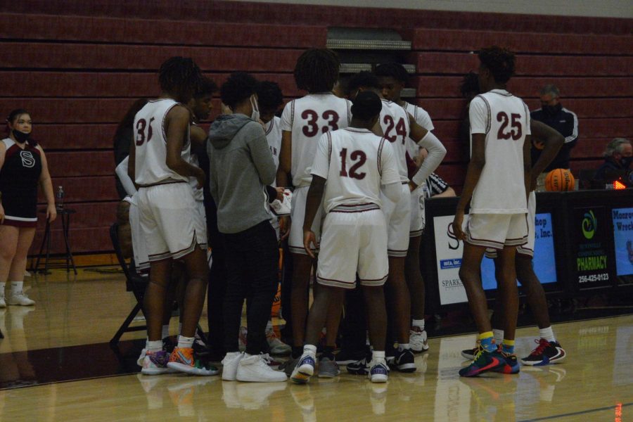 The team huddles up during a time-out. 