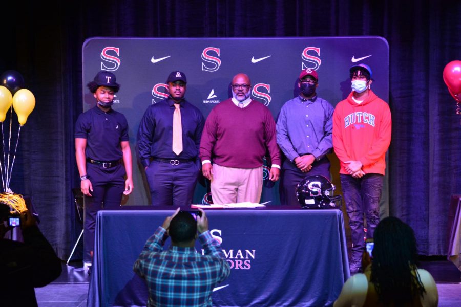 Four Senators signed college football scholarships on Wednesday, Dec. 15. 