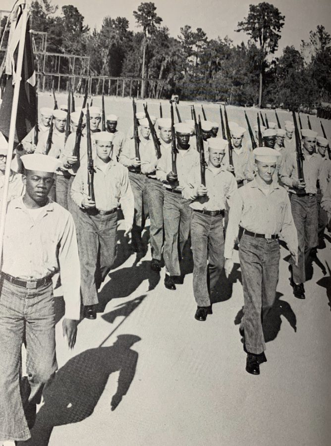 Bonner marches with other servicemen during his service. 