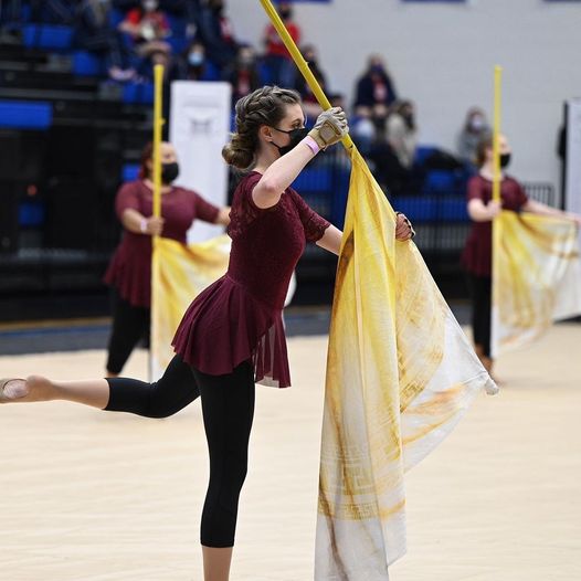 Members of the winter guard show case their routine at a recent competition.