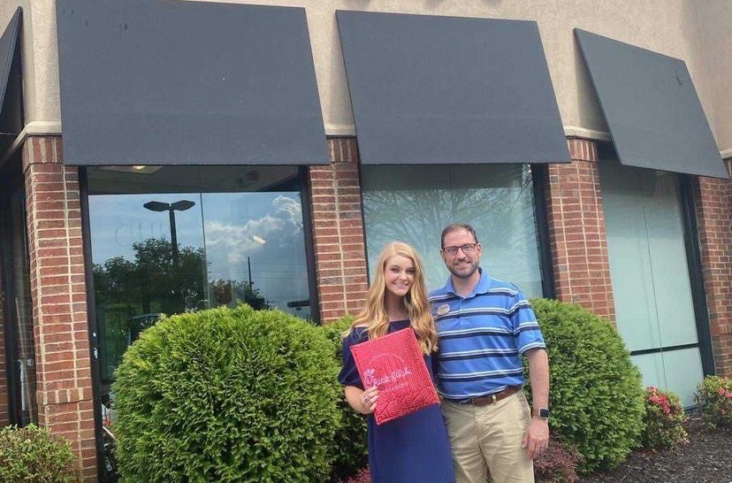 Posing+with+her+scholarship+certificate+from+Chick-fil-A%2C+senior+Sarah+Taylor+received+over+%245%2C000+in+scholarship+money.