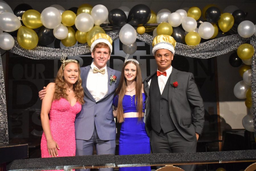 Seniors Laura Damewood, Myles Gollop and juniors Madison Allen and Jacob Edwards pose in their royal headgear. 