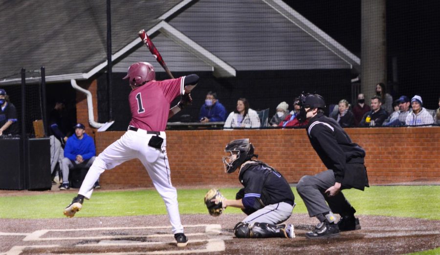 With his eye on the ball, senior Dillion Ysalgue gets ready to take a swing. 