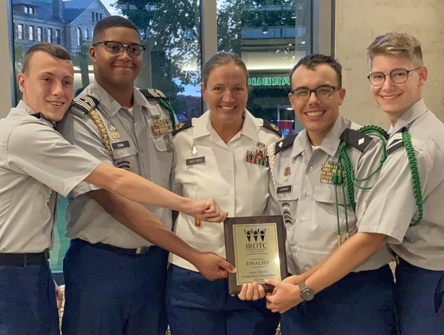 The cadet team and Sgt. Brown pose with their national award. 