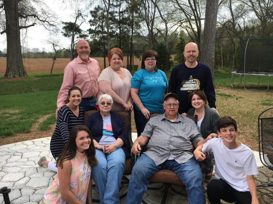 Journalism teacher Erin Coggins and her family pose for one of the last family events the Cartee family held with their Dad. 