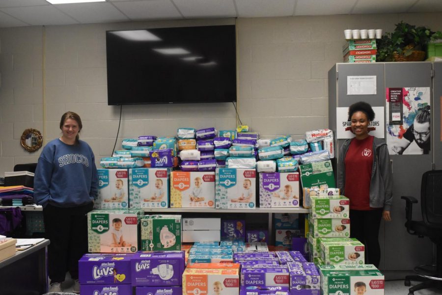 Showing off the quantity of diapers collected, FCCLA sponsor Karoline Webster and club president Hannah Stovall smile for the camera. 