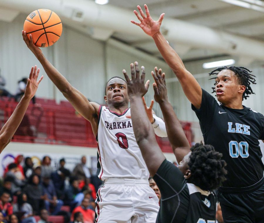 Going up for two points, senior Calen Lightford manuevers around a Lee defender. 