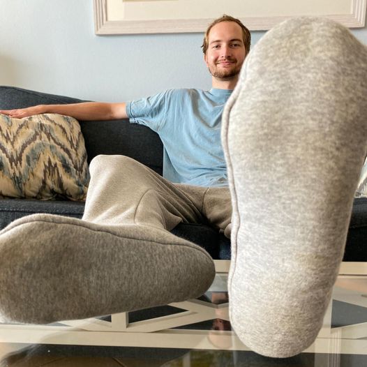 Showing off the selling point of of Cozy Toes, Quinn Frazier relaxes in his creation. 