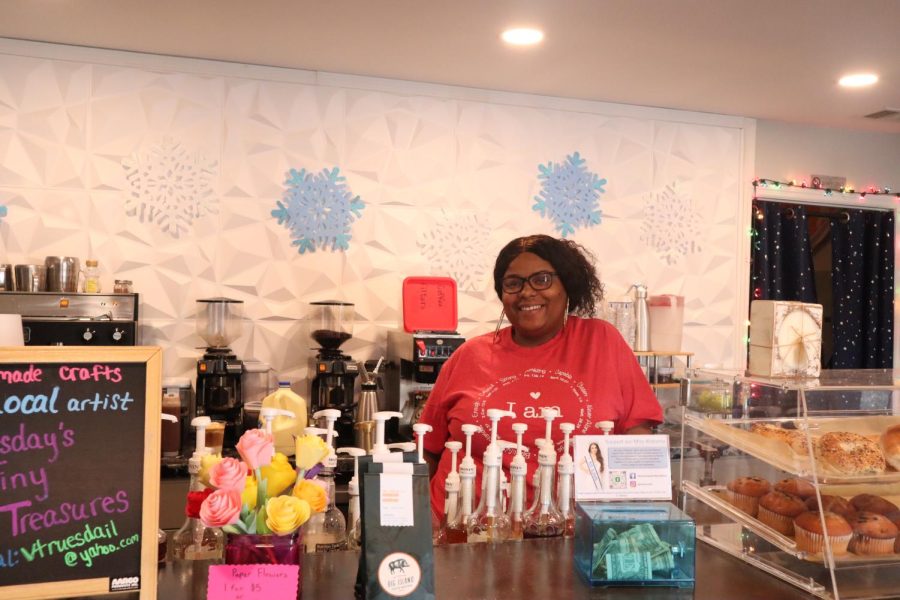Ebonie Stewart stands behind the counter at the Rocket City Coffee shop.