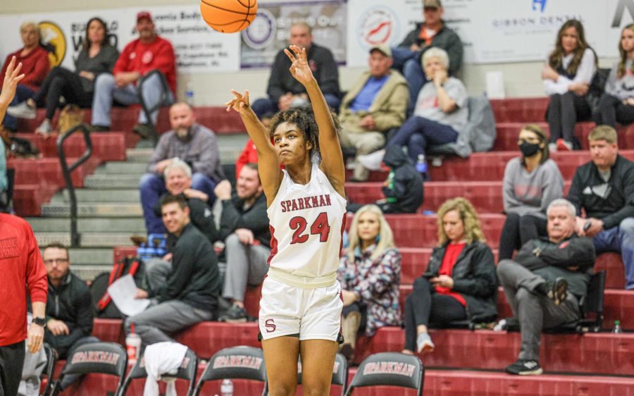 Rising up, junior Nylla Fuller takes a 3-point shot. The basket gave the Senators a 22 point lead. 