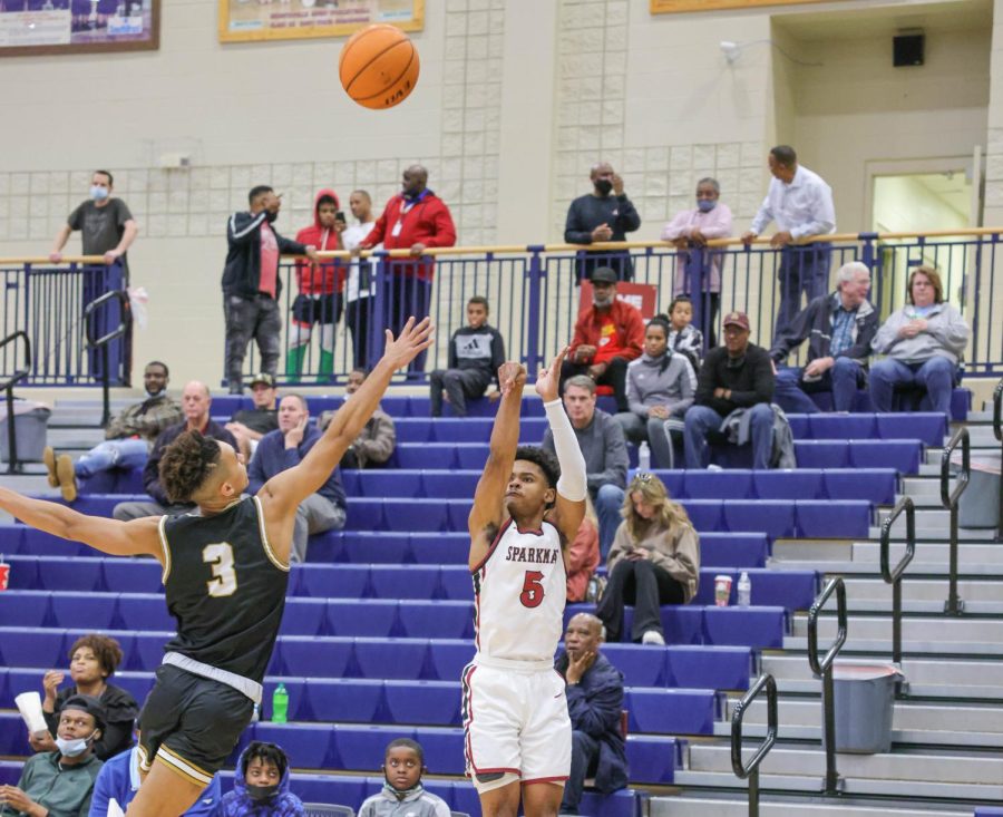 Junior Timbre Kirk gets a 3-point shot off with an Oxford defender in his face. Kirks ability to hit the three in all four tournament games led to he being named MVP.  